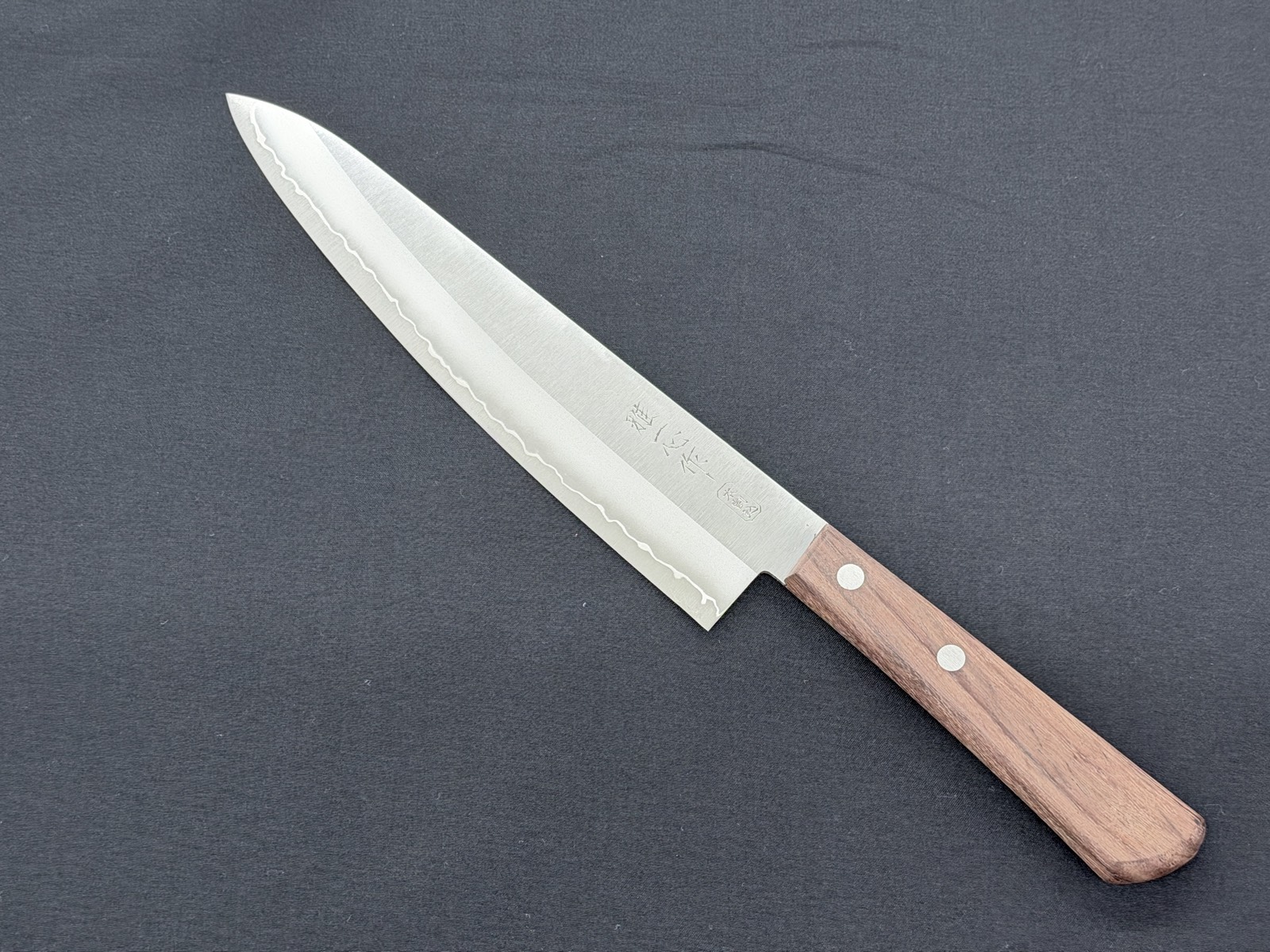 A santoku resharpened at Takanojin at great value, with the edge fully restored