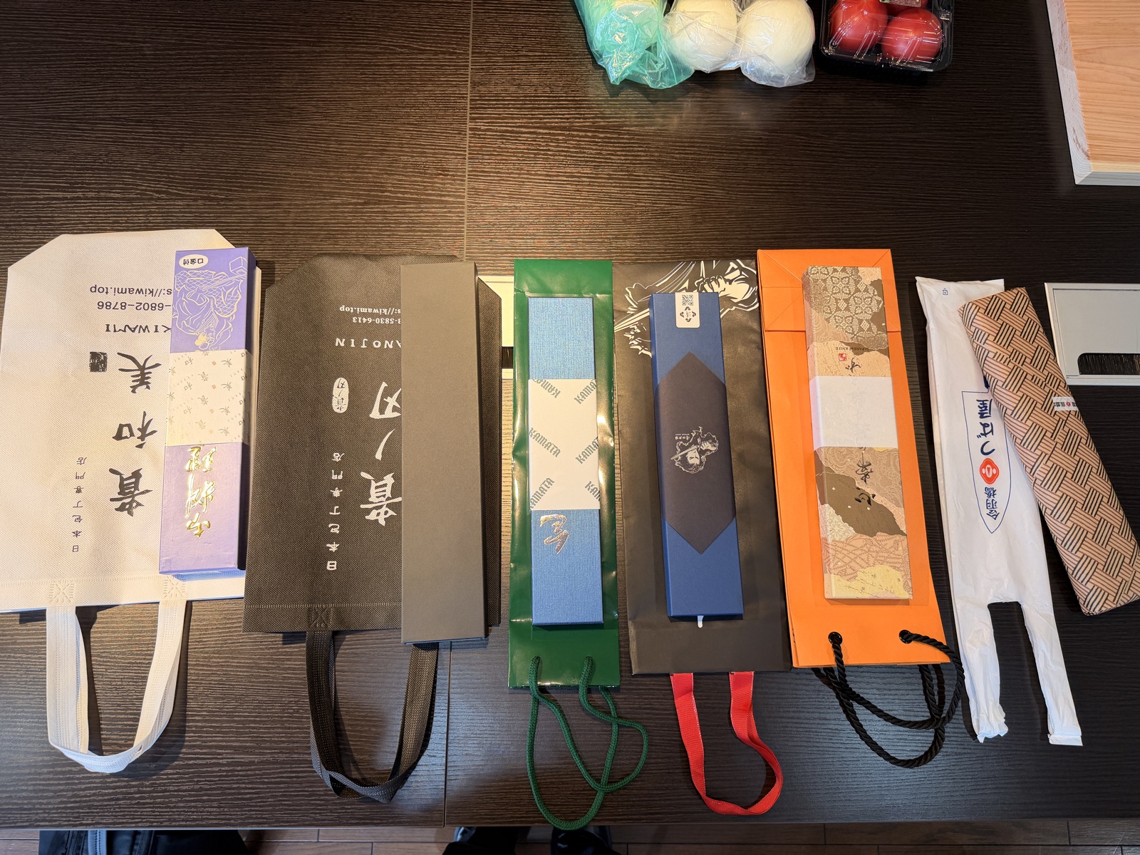 The packaging and shopping bags from all six shops laid out together